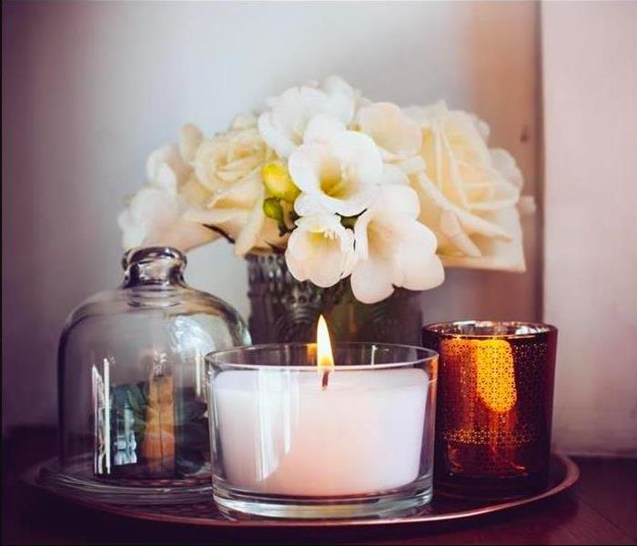 Flowers, and lit candle